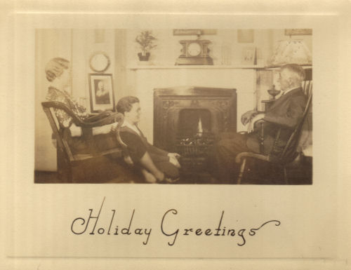 The Bridgman's 1938 Christmas Card with Ruth, Lucy, and their father in front of the fireplace at 5 Lambert Avenue in Roxbury, Massachusetts