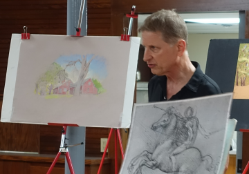 Greg using a Da Vinci sketch to illustrate