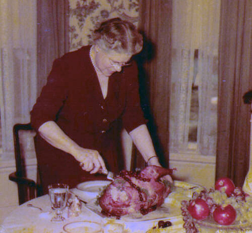 Ethel carving the turkey for Thanksgiving Dinner,  November 1953. 