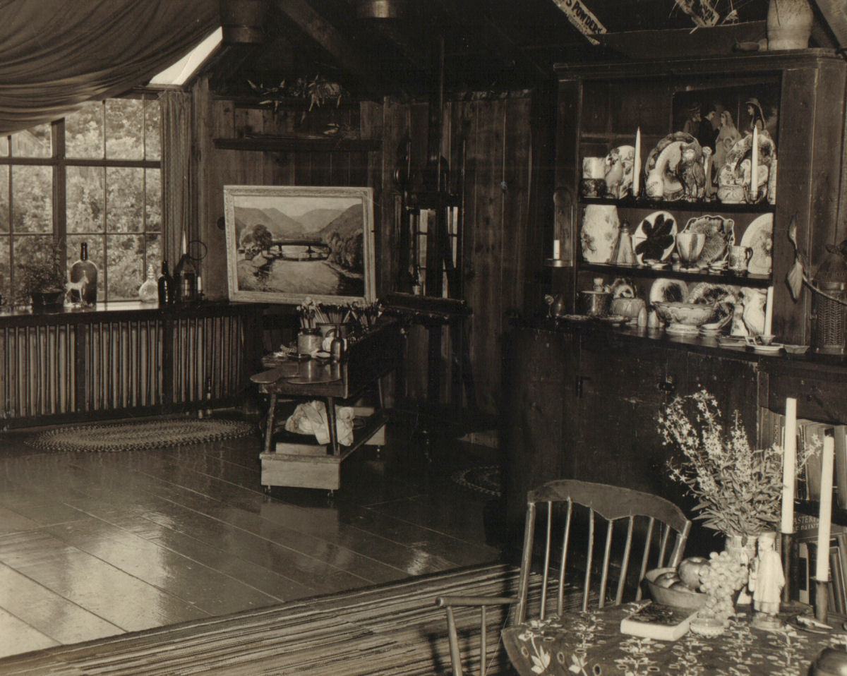 Interior view of the Southwick Studio showing the North window and the Majolica collection.  The painting Through Summer Hills is shown in the corner. 