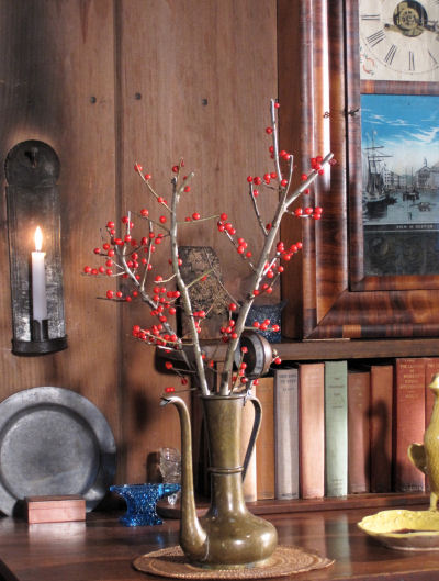 Red berried Black Alder beneath studio 'Boston' clock.  